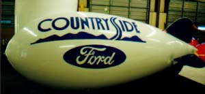 Advertising Blimps - Countryside Ford logo. 14ft. blimps from $665 w/o artwork. 14ft. helium blimps w/artwork or logos from $1021.00.